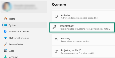 Windows 11 System settings with Troubleshoot highlighted.